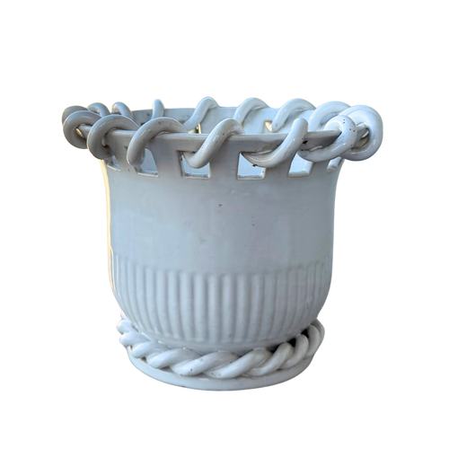 A white ceramic planter pot with a fluted ribbed body, featuring a decorative rope-wrapped rim and matching rope detail around the base, isolated on a white background.