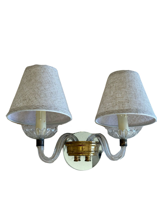 Wall sconce with two lampshades on a white background