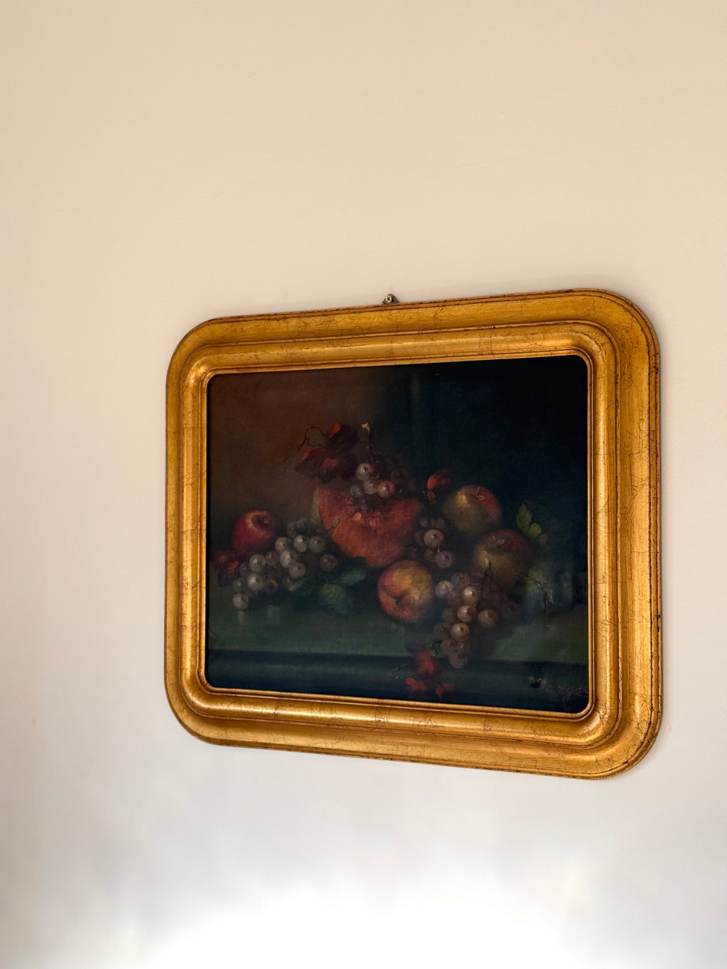 still life in gold frame on wall