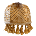 Warm coloured material lampshade with beige and orange fringe tassel around the base. 