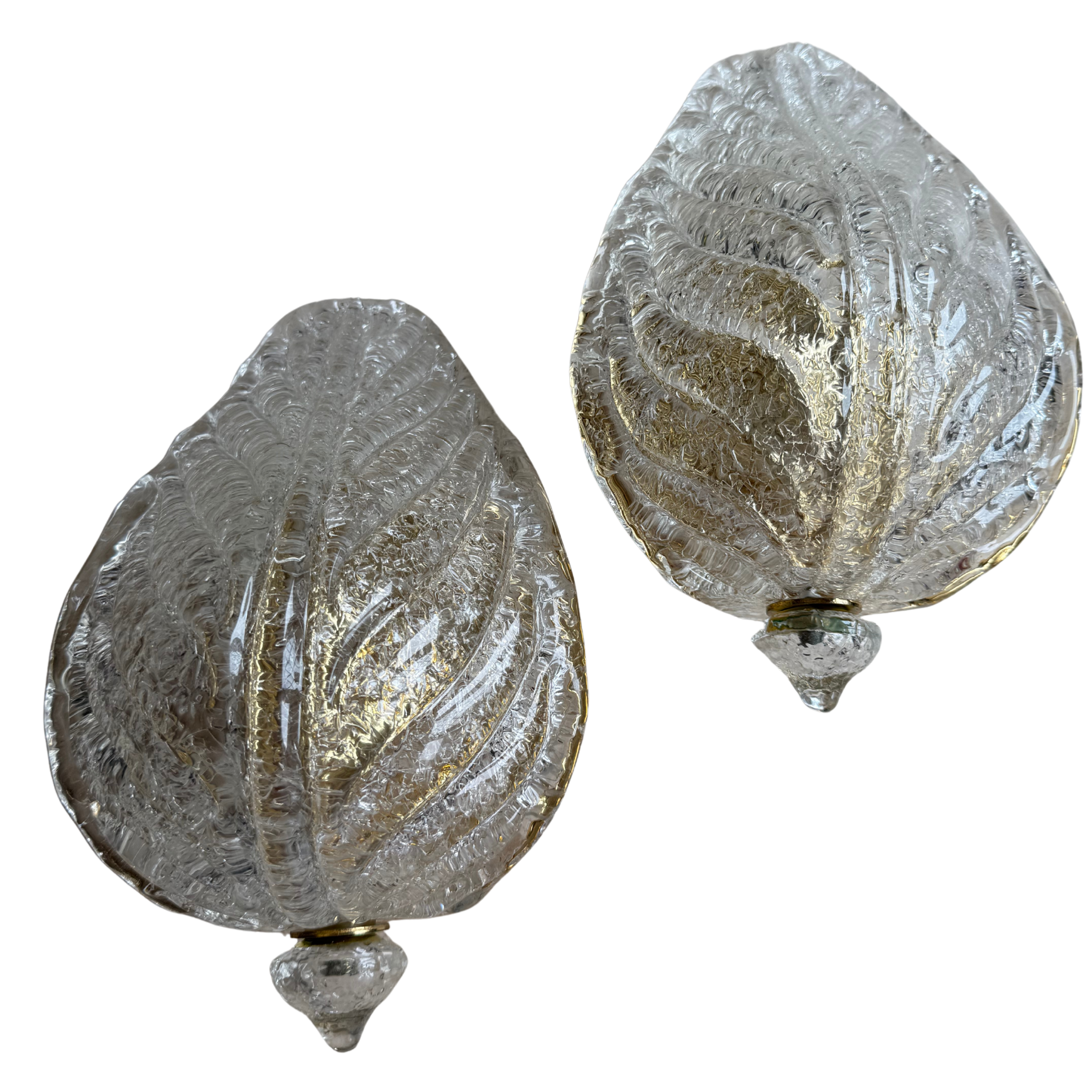 Two decorative glass ornaments with textured surface on a white background