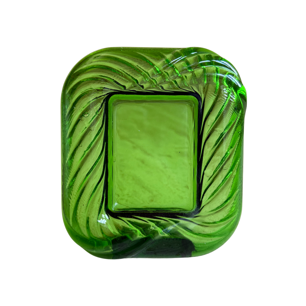 A square green glass picture frame with a thick, thickened center and a swirled, ribbed border, shown on a plain white background.