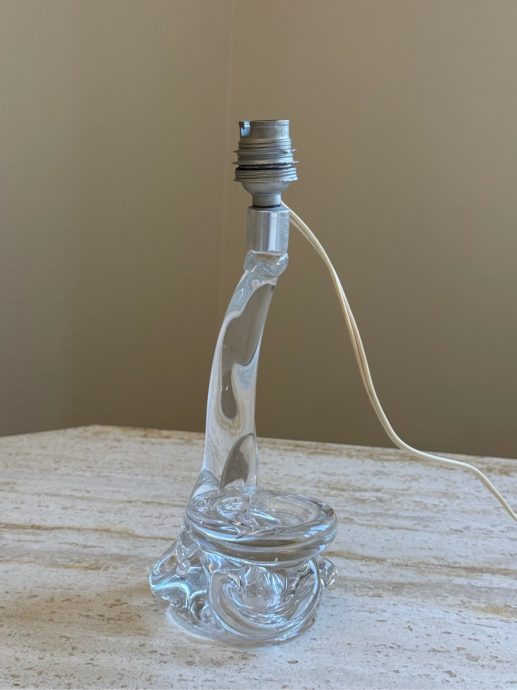 glass lamp base on stone table