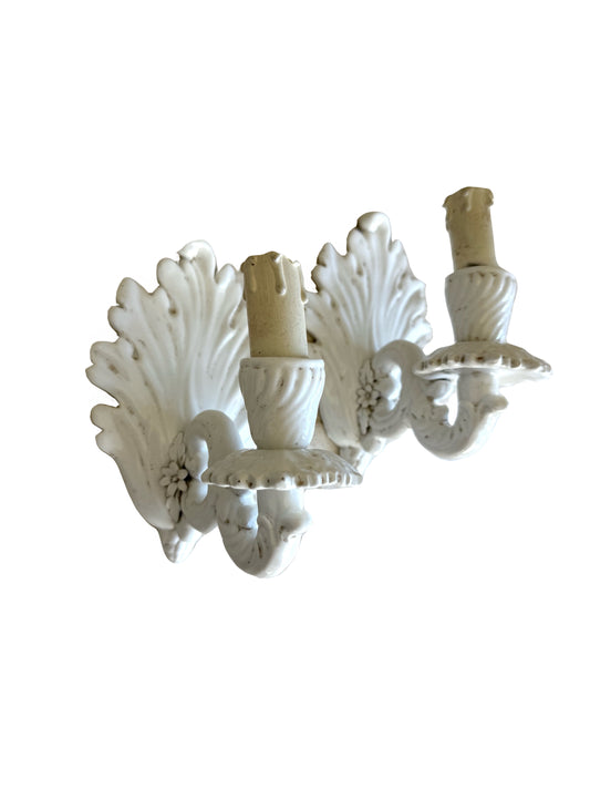 Decorative white wall sconce with intricate design floral 