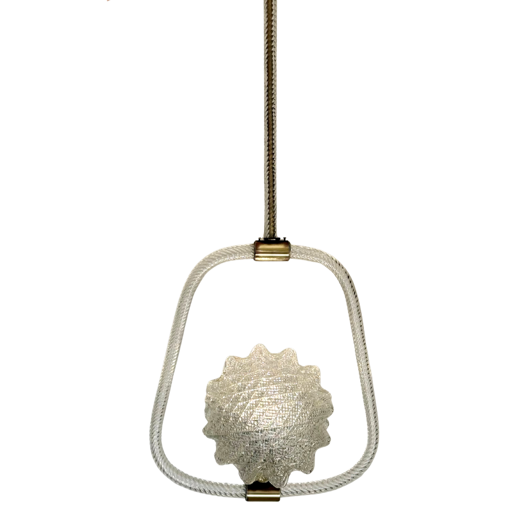 A hanging pendant light fixture with a textured metallic shell-shaped bulb, a white braided rope frame, and brass-toned hardware against a plain white background.