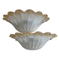 Two vintage Venetian Murano glass sconces with a textured, ribbed shell-like design and a warm amber-brown tint along the scalloped edges, shown against a plain white background.