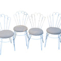 Four vintage-style metal dining chairs with light blue painted frames and striped gray cushions, shown against a plain white background.